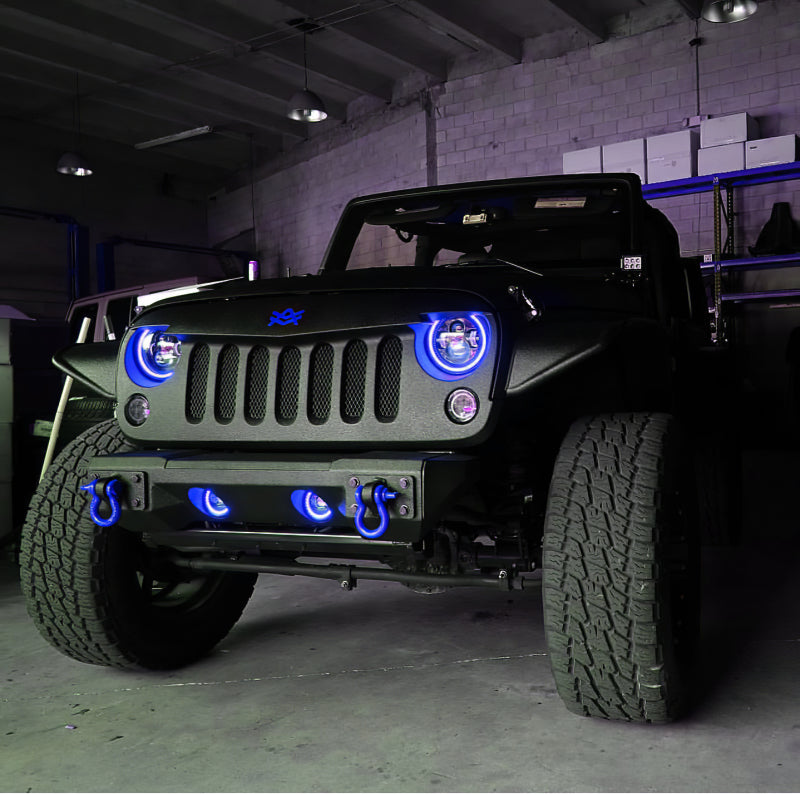 Oracle 7in High Powered LED Headlights with black bezel, showcasing dynamic color features and rugged design for Jeep Wrangler and off-road vehicles.