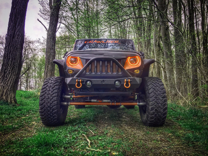 Oracle 7in High Powered LED Headlights with black bezel, showcasing dynamic color features and rugged design for Jeep Wrangler and off-road vehicles.