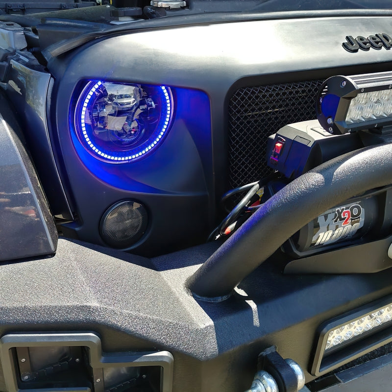 Oracle 7in High Powered LED Headlights with black bezel, showcasing dynamic color features and rugged design for Jeep Wrangler and off-road vehicles.