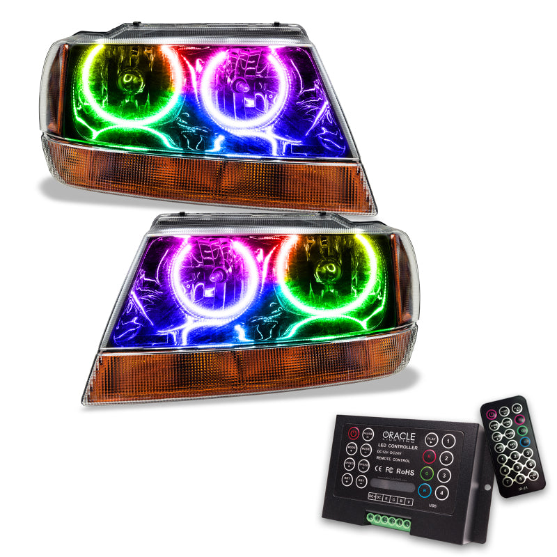 Oracle 99-04 Jeep Grand Cherokee black pre-assembled headlights with ColorSHIFT halo rings, showcasing modern automotive lighting technology.