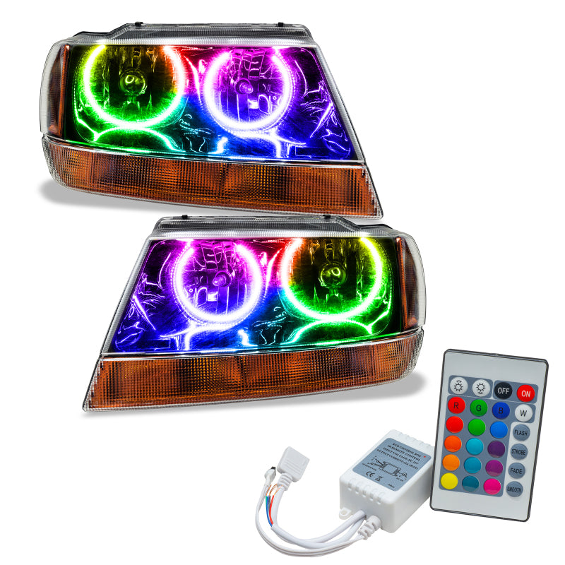 Oracle 99-04 Jeep Grand Cherokee black pre-assembled headlights with ColorSHIFT halo rings installed, showcasing a sleek design.