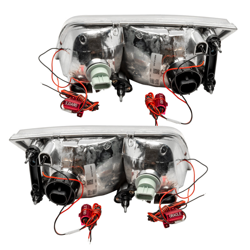 ORACLE 98-11 Ford Crown Victoria SMD Halogen headlights with chrome housing and halo rings, showcasing a modern and stylish design.