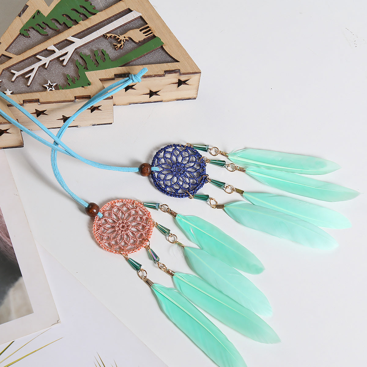Small Fresh Feather Dream Catcher pendant for car rearview mirror, featuring delicate feathers and Nordic design.