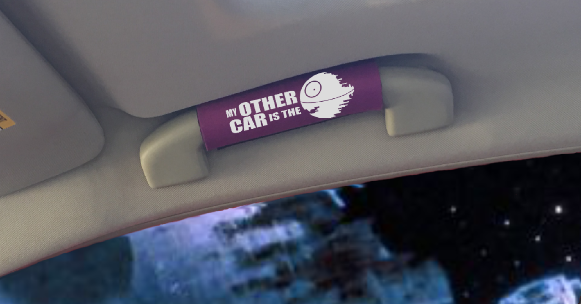 The DeathStar Grip 2 featuring smooth artwork and a soft base, designed for vehicle interiors.