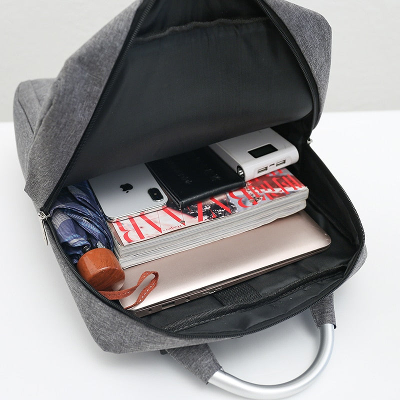 Luxury waterproof nylon backpack for men with USB charging port, featuring adjustable straps and spacious compartments for laptops and essentials.