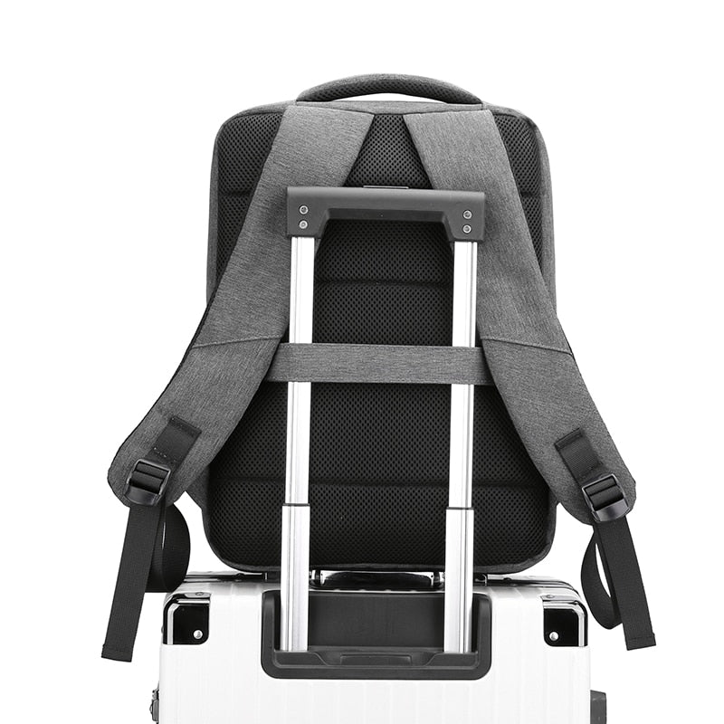 Multifunctional waterproof backpack for men with USB charging port, featuring a stylish patchwork design and multiple compartments.