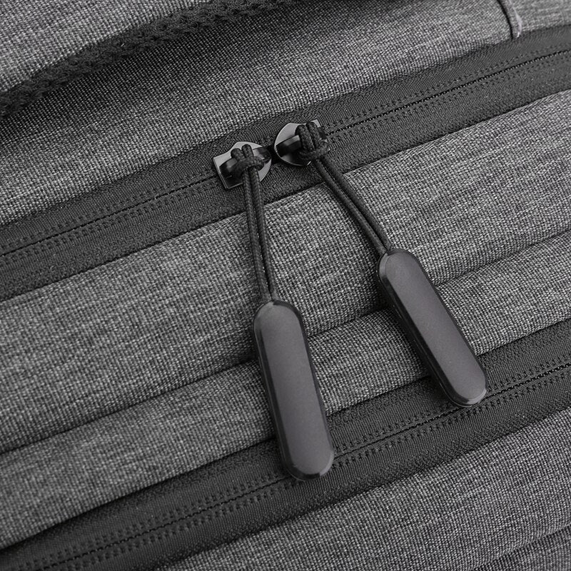 Multifunctional waterproof backpack for men with USB charging port, featuring a stylish patchwork design and multiple compartments.