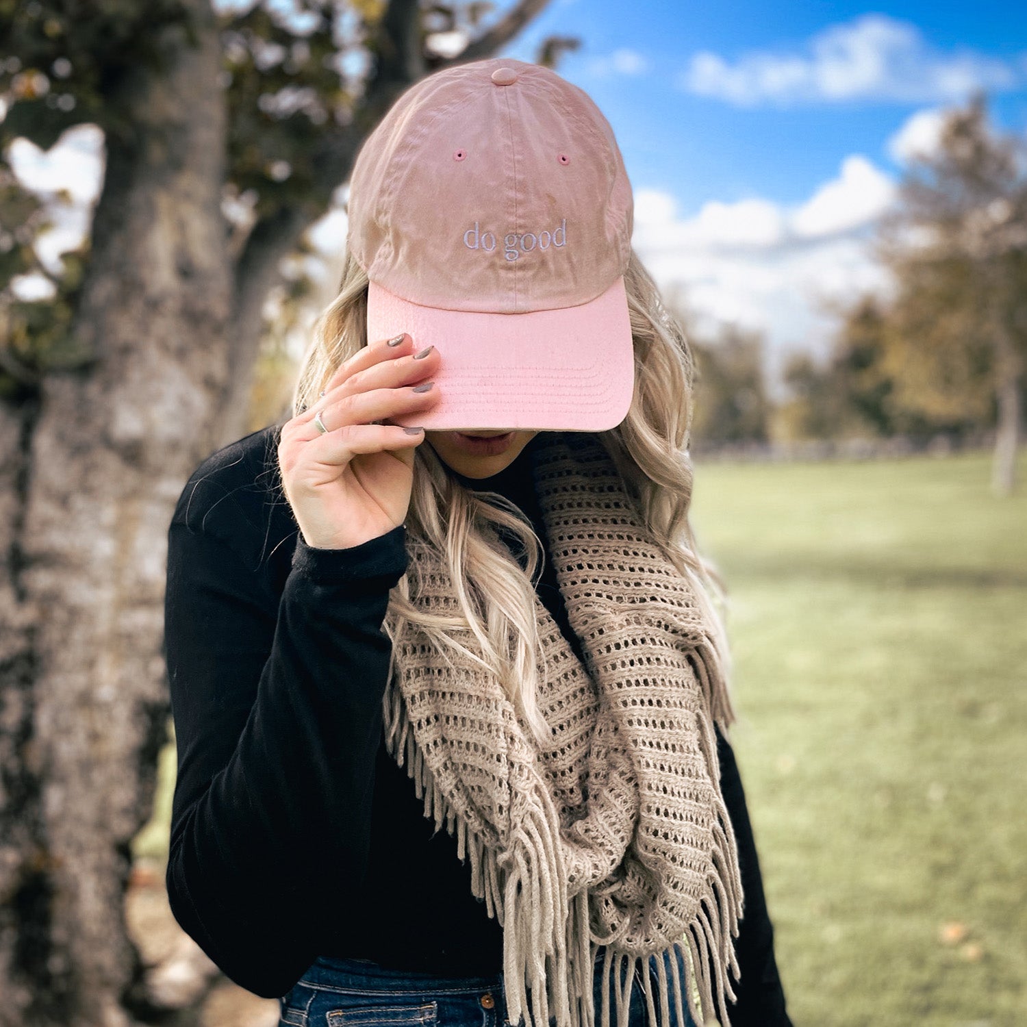 Stylish Sittin' Pretty Pink baseball hat with adjustable strap and 'Do Good' embroidery.