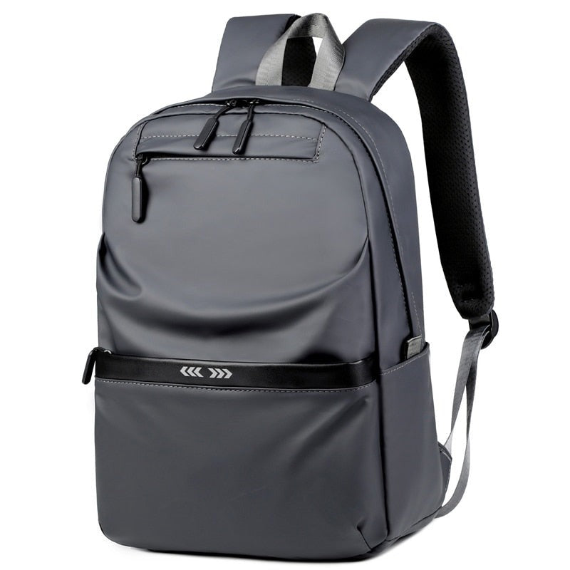 A stylish business backpack for men made of high-quality nylon, featuring multiple pockets and designed to hold a 15.6-inch laptop.