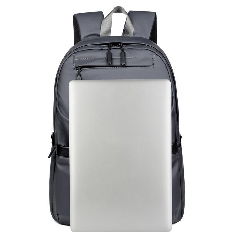 A stylish business backpack for men made of high-quality nylon, featuring multiple pockets and designed to hold a 15.6-inch laptop.