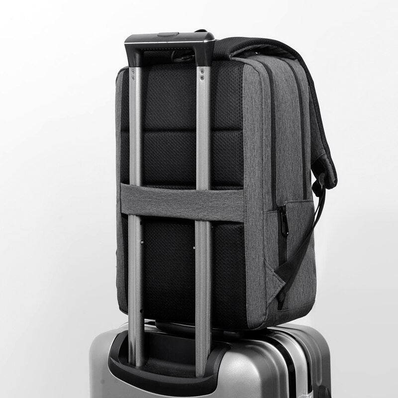 A stylish and multifunctional business backpack for men, featuring waterproof Oxford material, USB charging port, and multiple interior pockets.