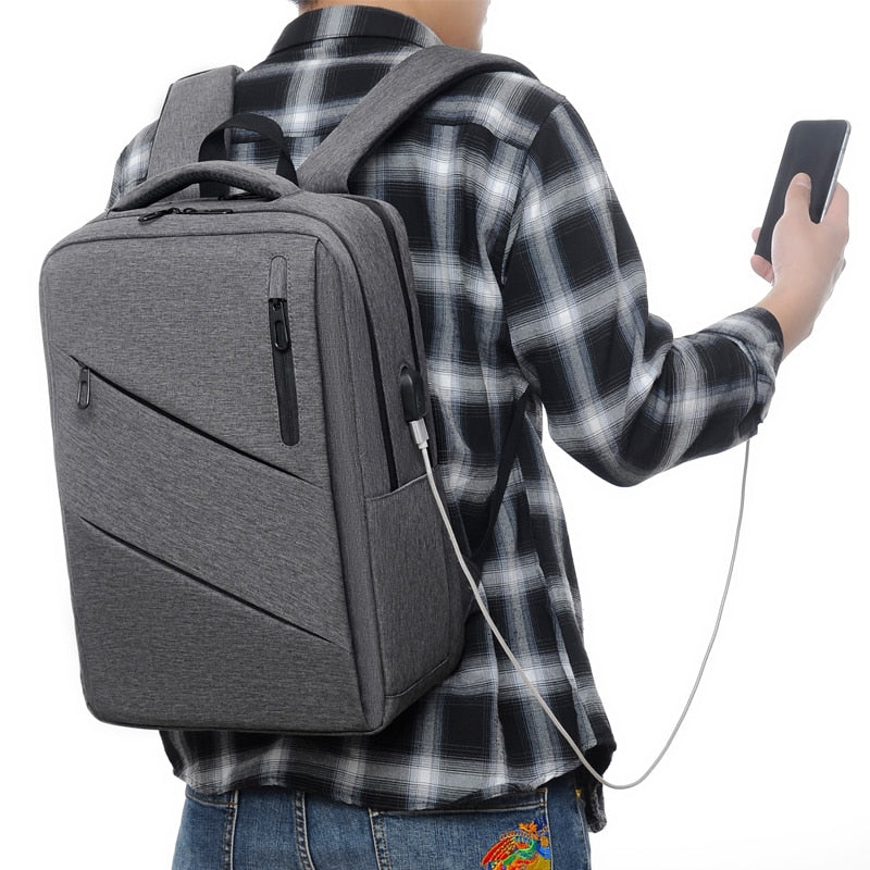 A stylish and multifunctional business backpack for men, featuring waterproof Oxford material, USB charging port, and multiple interior pockets.