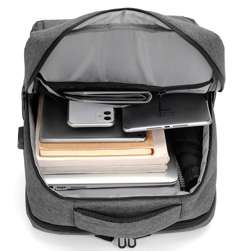 A stylish and multifunctional business backpack for men, featuring waterproof Oxford material, USB charging port, and multiple interior pockets.