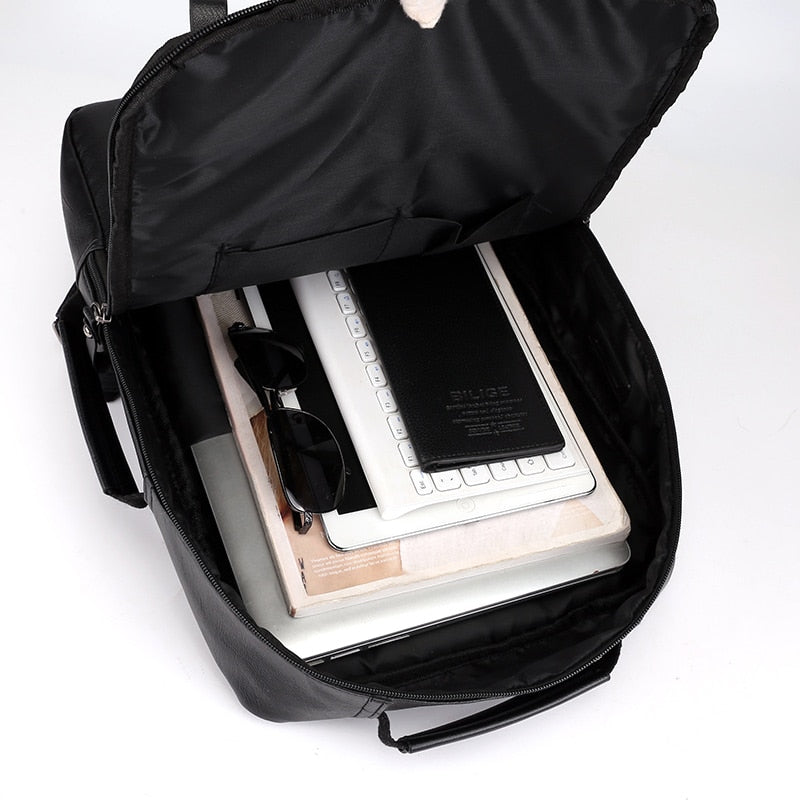 Large waterproof PU leather business backpack for men, featuring multiple compartments and a stylish design, perfect for carrying laptops and essentials.