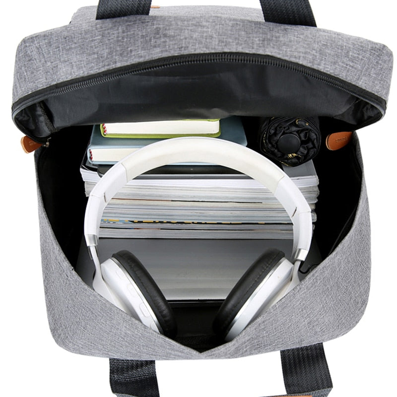 Business casual backpack for men made of waterproof Oxford cloth, featuring multiple compartments and a stylish solid design.