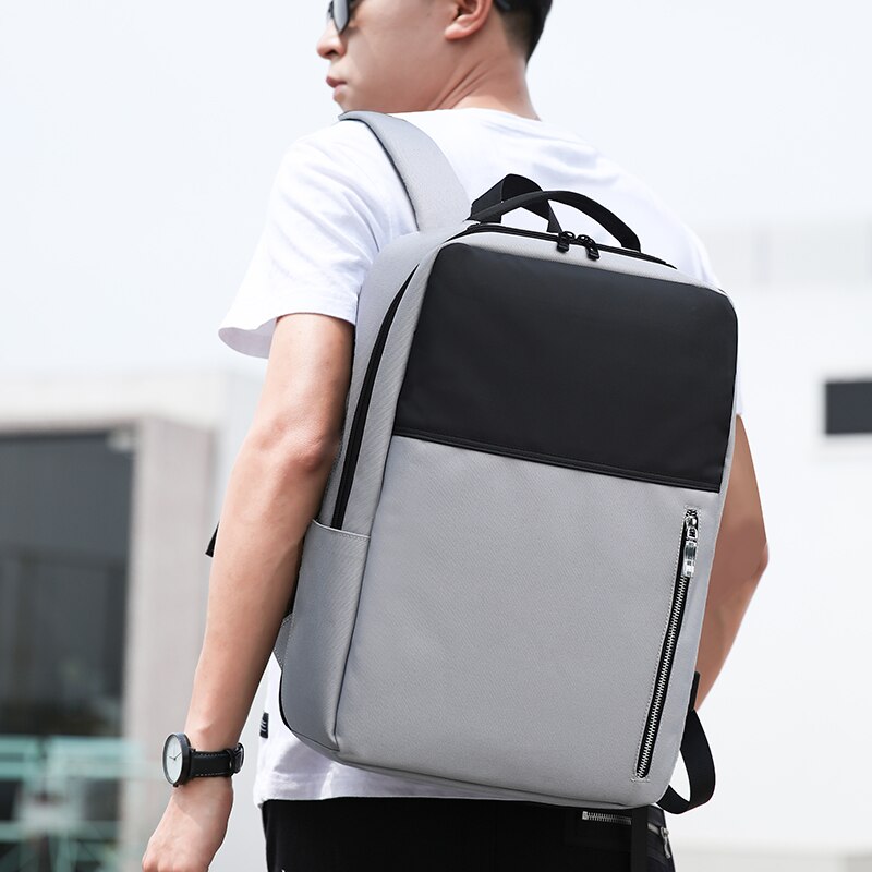Business Men's Backpack featuring USB charging port, large capacity, and multiple compartments, made from durable Oxford material.
