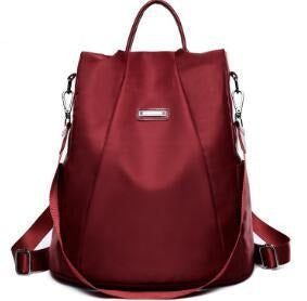 A stylish Canvas Travel Waterproof Oxford Backpack in a sleek design, showcasing its durable fabric and spacious compartments.