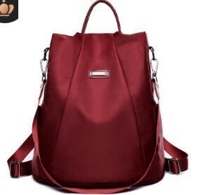 A stylish Canvas Travel Waterproof Oxford Backpack in a sleek design, showcasing its durable fabric and spacious compartments.