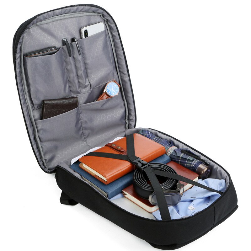 Casual backpack for men made of Oxford cloth, featuring USB charging port and multiple interior pockets, ideal for business and casual use.