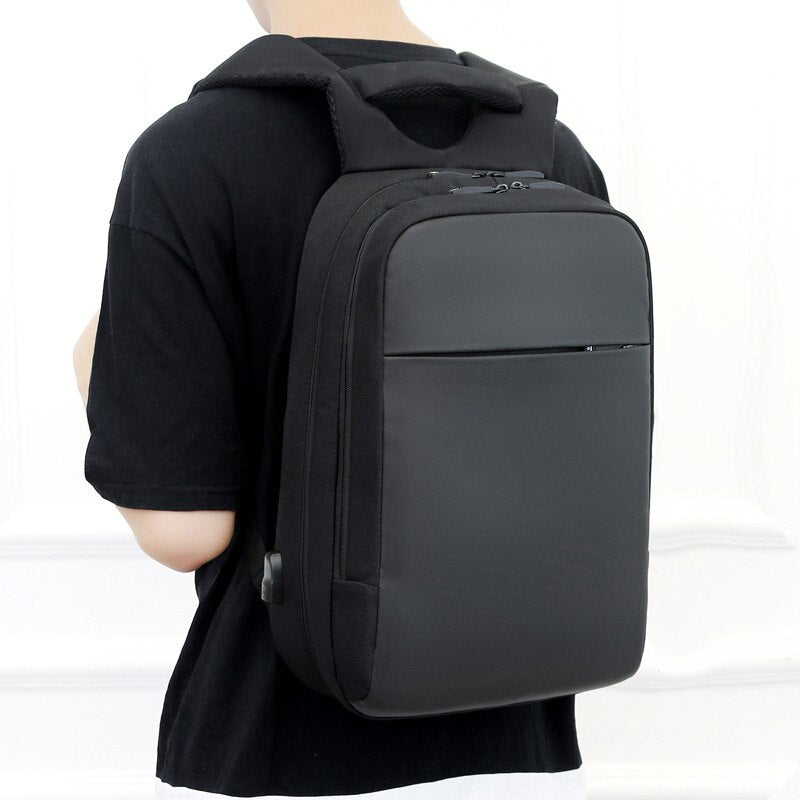 Casual backpack for men made of Oxford cloth, featuring USB charging port and multiple interior pockets, ideal for business and casual use.