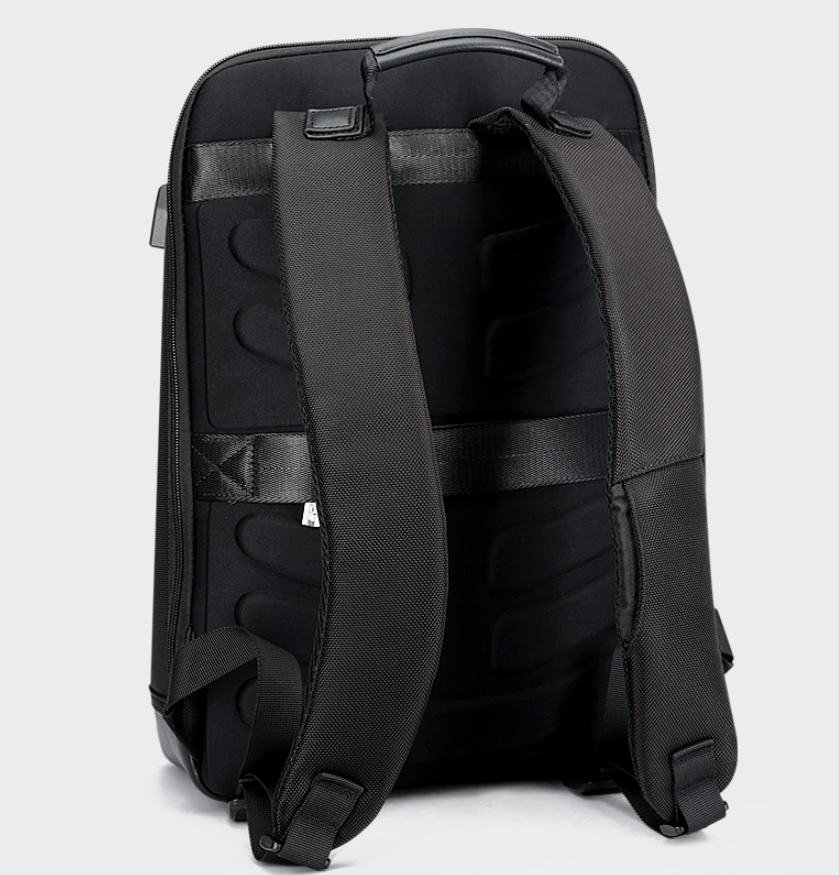 Casual black backpack for men featuring adjustable shoulder straps and durable microfiber PU leather material.