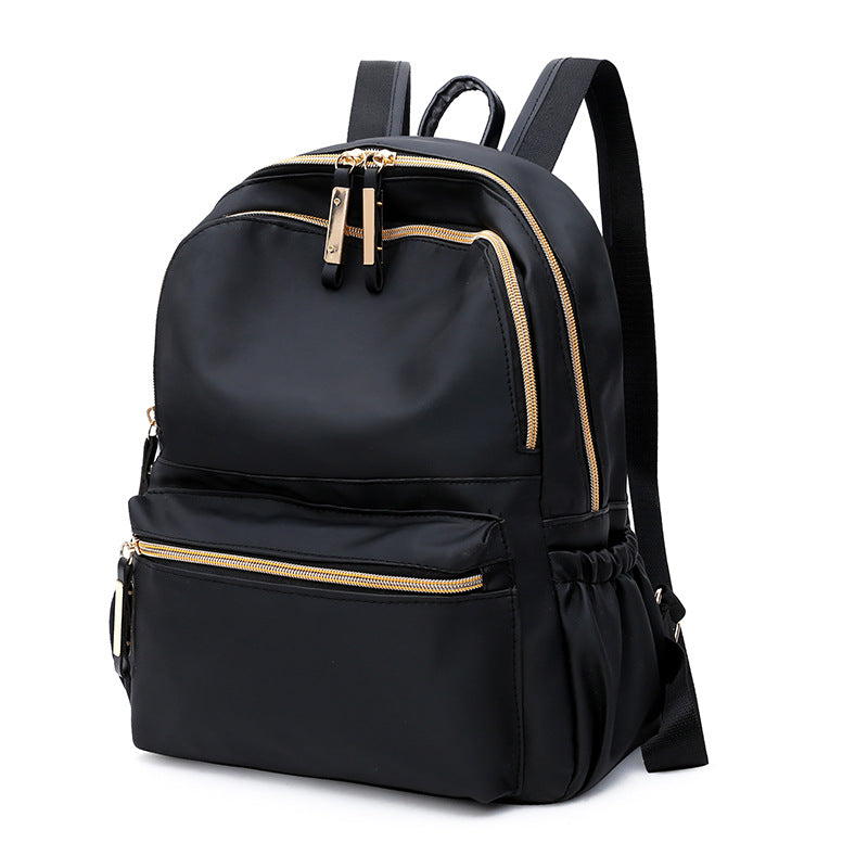 Stylish European and American style female backpack made of breathable Oxford cloth, featuring multiple pockets and a soft surface.