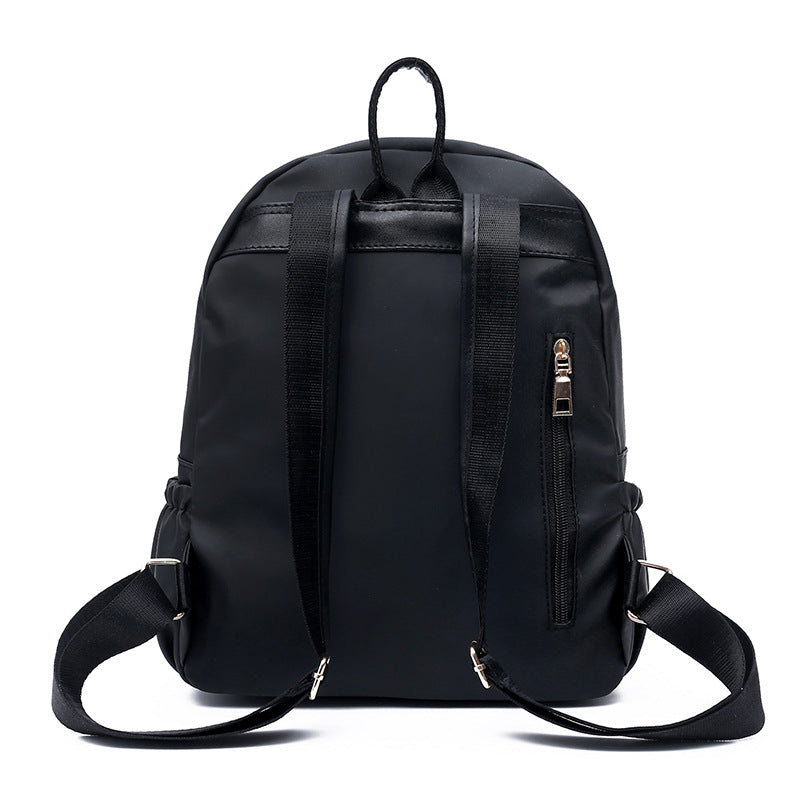 Stylish European and American style female backpack made of breathable Oxford cloth, featuring multiple pockets and a soft surface.