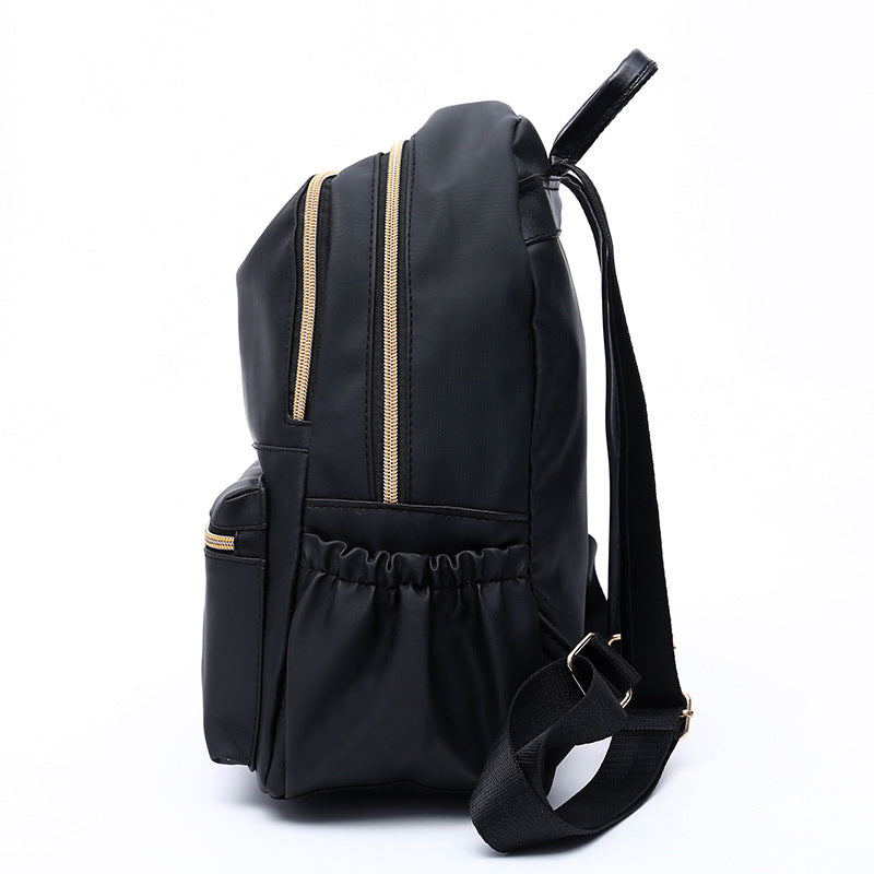 Stylish European and American style female backpack made of breathable Oxford cloth, featuring multiple pockets and a soft surface.