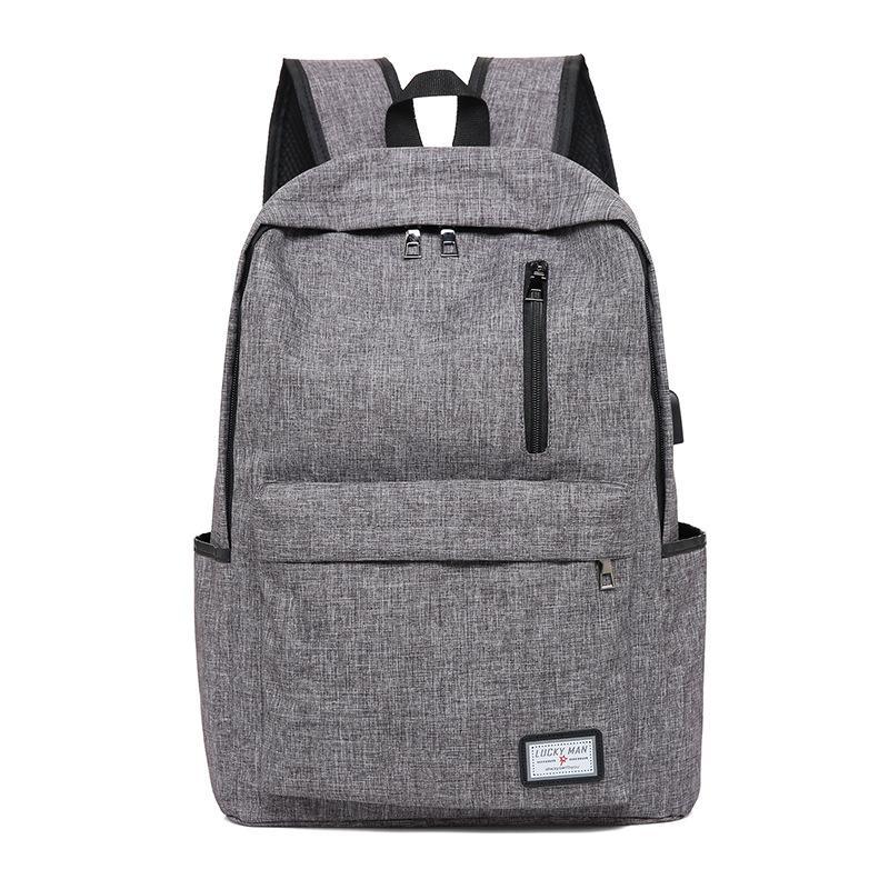 Fashion Business Backpack made of durable Oxford cloth with USB charging interface, featuring a zipper opening and spacious compartments.