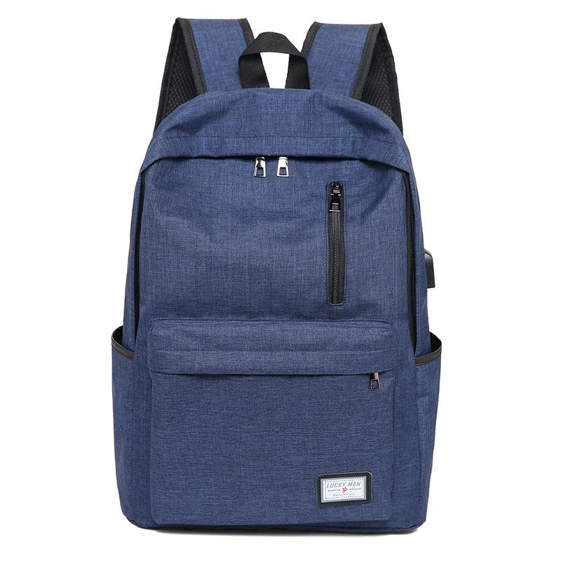 Fashion Business Backpack made of durable Oxford cloth with USB charging interface, featuring a zipper opening and spacious compartments.