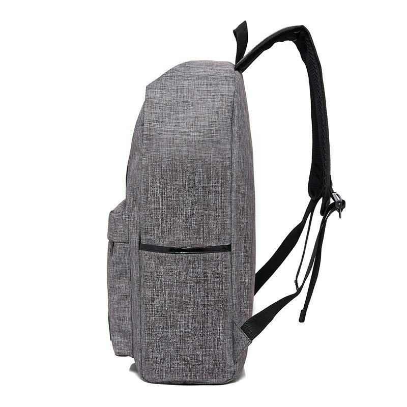 Fashion Business Backpack made of durable Oxford cloth with USB charging interface, featuring a zipper opening and spacious compartments.