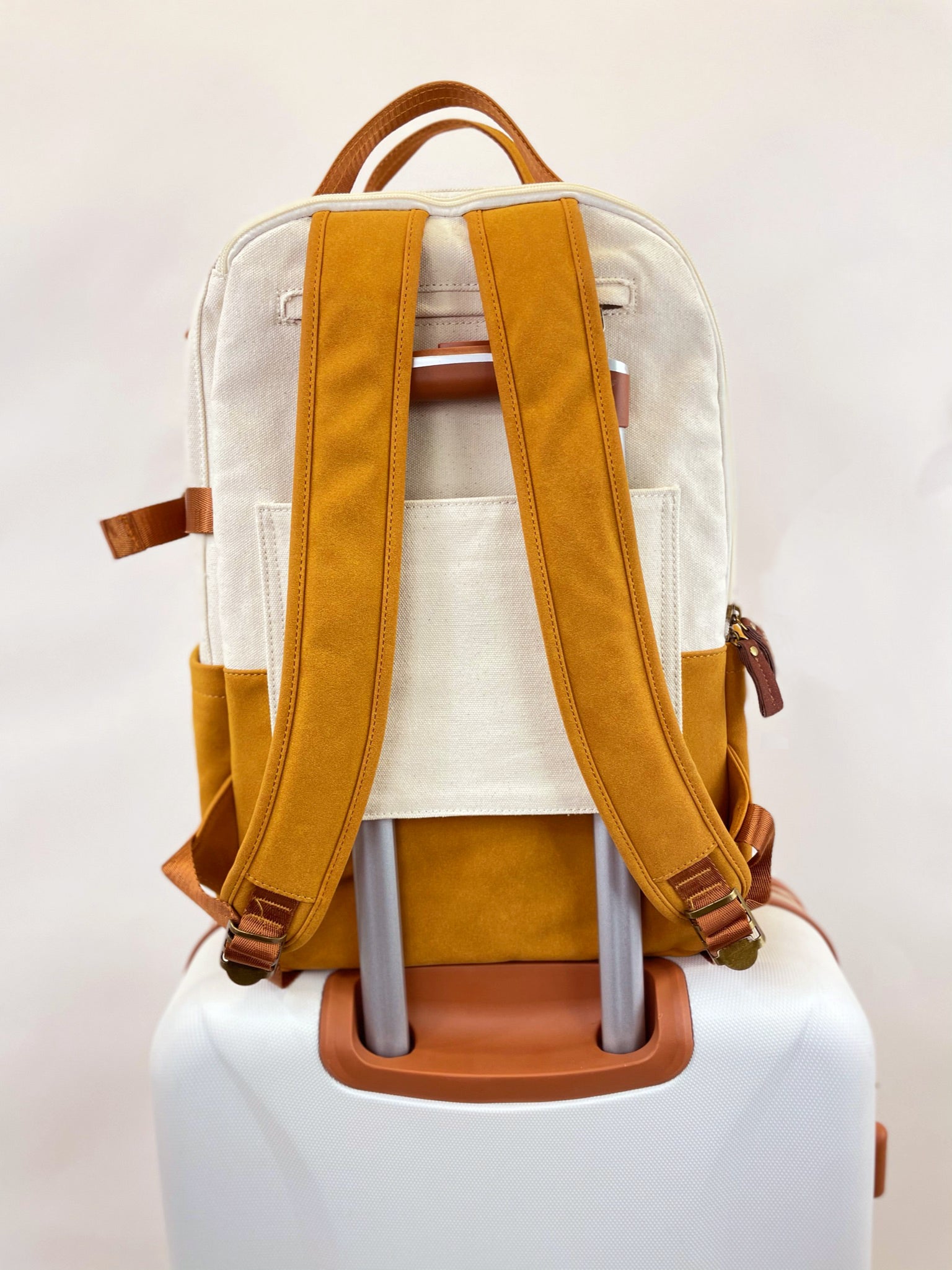 Good To Go Backpack in Bliss Curry/Cream, featuring a stylish design with multiple pockets and a padded laptop compartment.