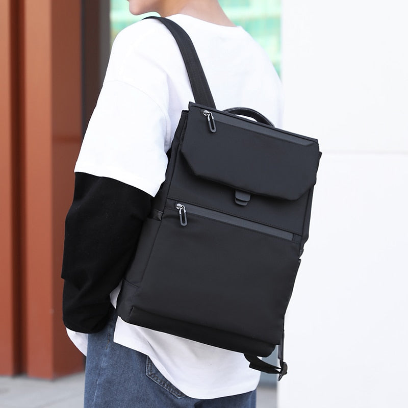 Men's multifunctional waterproof backpack made of Oxford cloth, featuring multiple pockets and a sleek design, ideal for business and casual use.