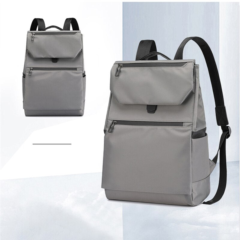 Men's multifunctional waterproof backpack made of Oxford cloth, featuring multiple pockets and a sleek design, ideal for business and casual use.