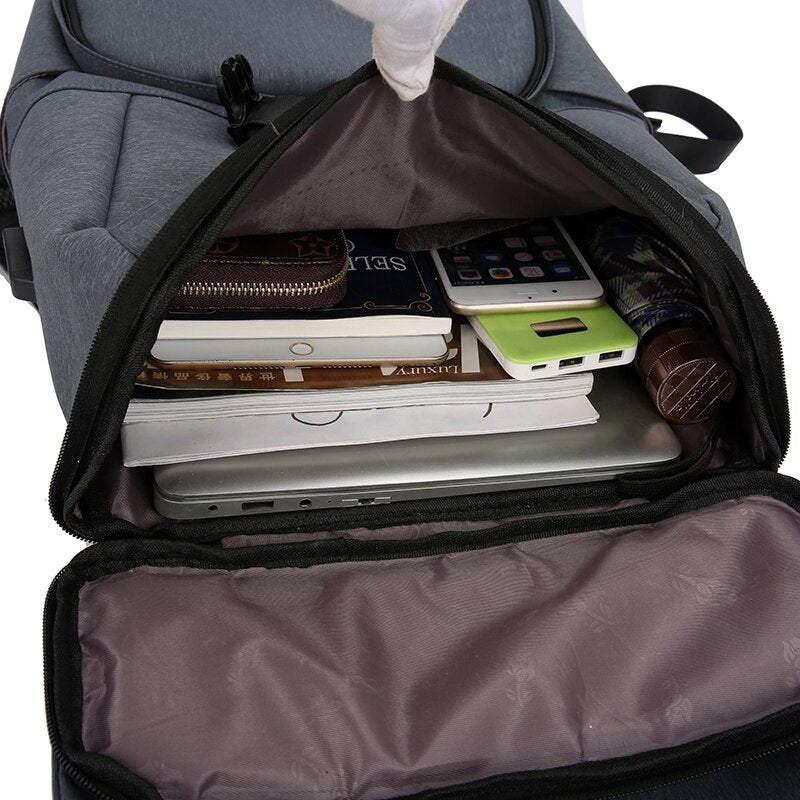 Men's multifunctional backpack with USB charging port, waterproof design, and multiple pockets for organization, suitable for business and travel.
