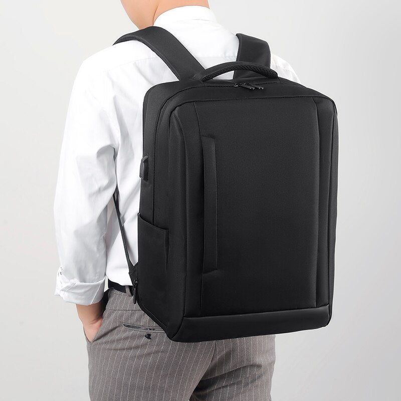 Men's Fashion Business Backpack Rucksack in black nylon with USB charging port, showcasing adjustable straps and spacious interior pockets.