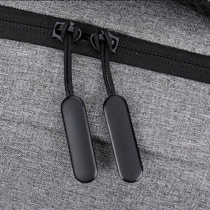 Men's multifunctional waterproof luxury bag designed for laptops with USB charging port, featuring multiple compartments and a stylish solid pattern.