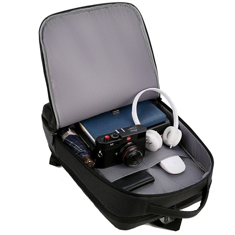 Mens multifunctional waterproof notebook backpack with USB charging port, made from durable Oxford material, featuring multiple pockets and a sleek design.