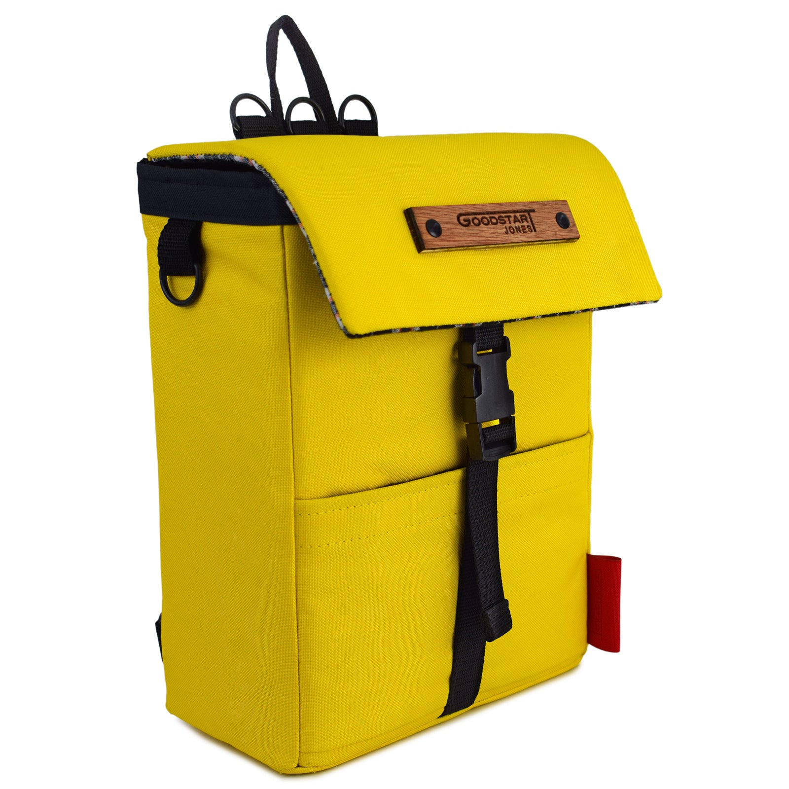 Mini Merchant Backpack in bright yellow, showcasing its multifunctional design as a backpack and crossbody bag.