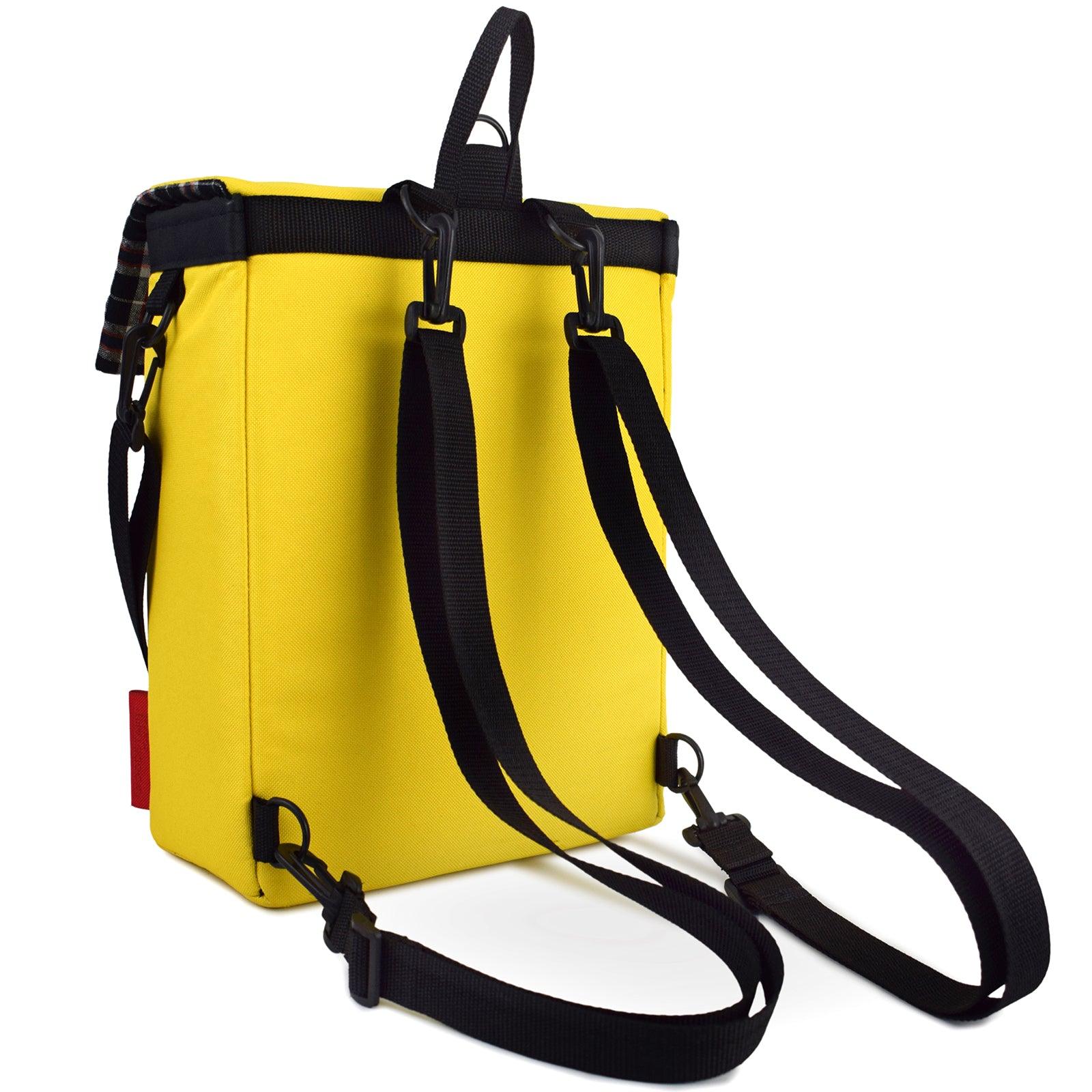 Mini Merchant Backpack in bright yellow, showcasing its multifunctional design as a backpack and crossbody bag.