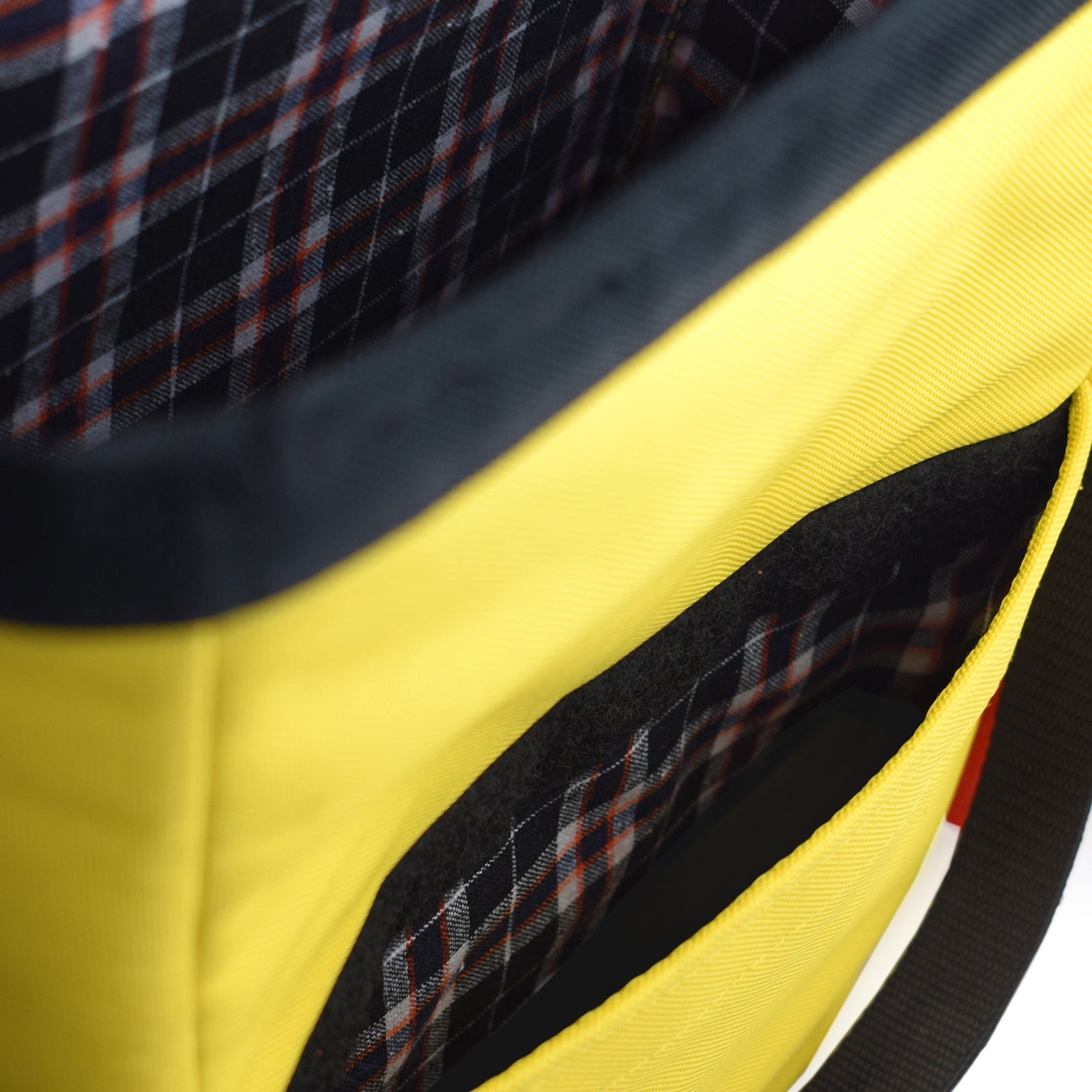 Mini Merchant Backpack in bright yellow, showcasing its multifunctional design as a backpack and crossbody bag.