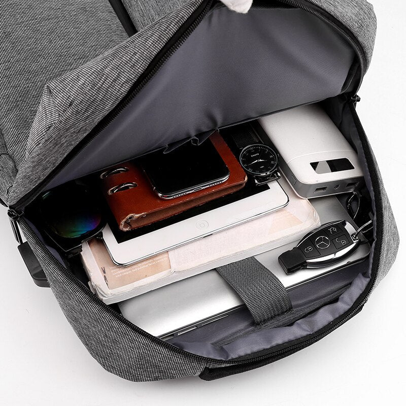 New Men's Business Backpack made of durable nylon, featuring multiple pockets and a sleek design, ideal for carrying laptops and daily essentials.