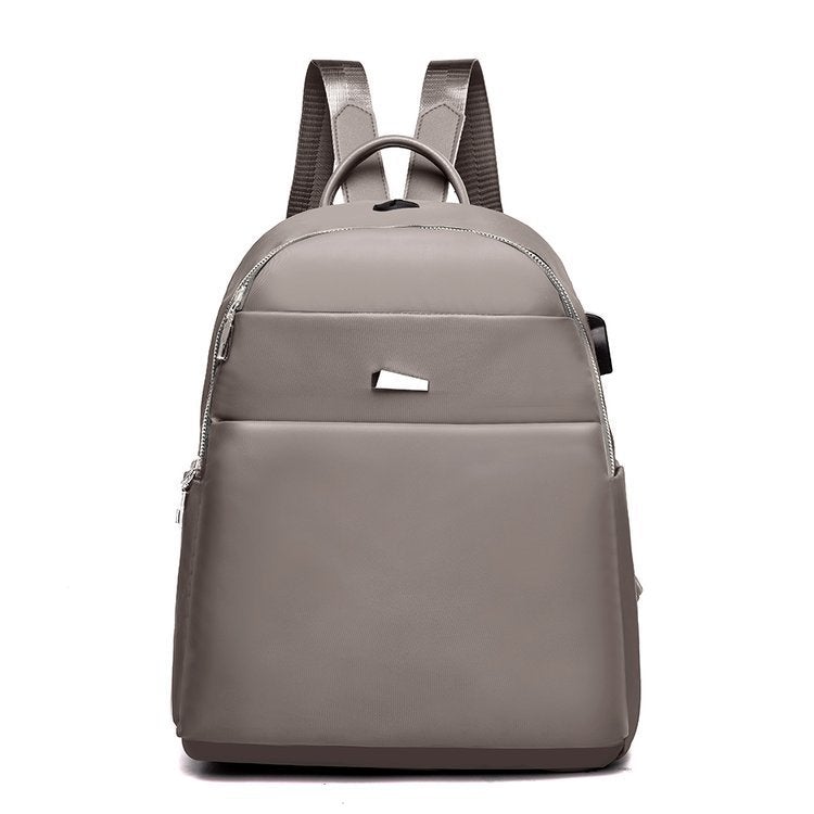 Oxford Cloth Fashion Casual Backpack featuring a USB port, waterproof design, and stylish street fashion elements.