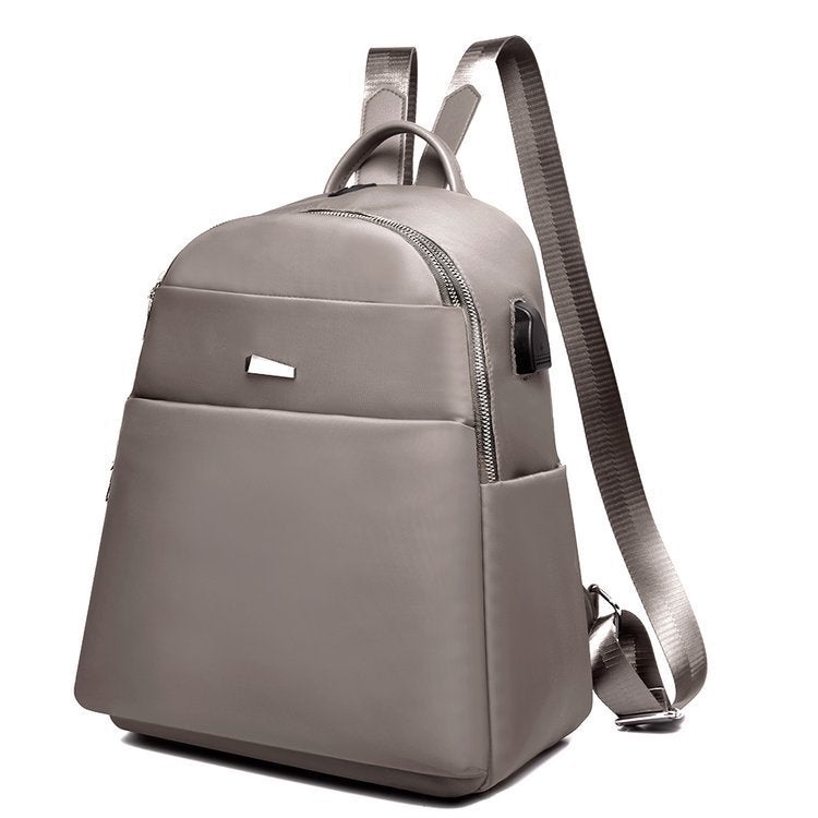 Oxford Cloth Fashion Casual Backpack featuring a USB port, waterproof design, and stylish street fashion elements.