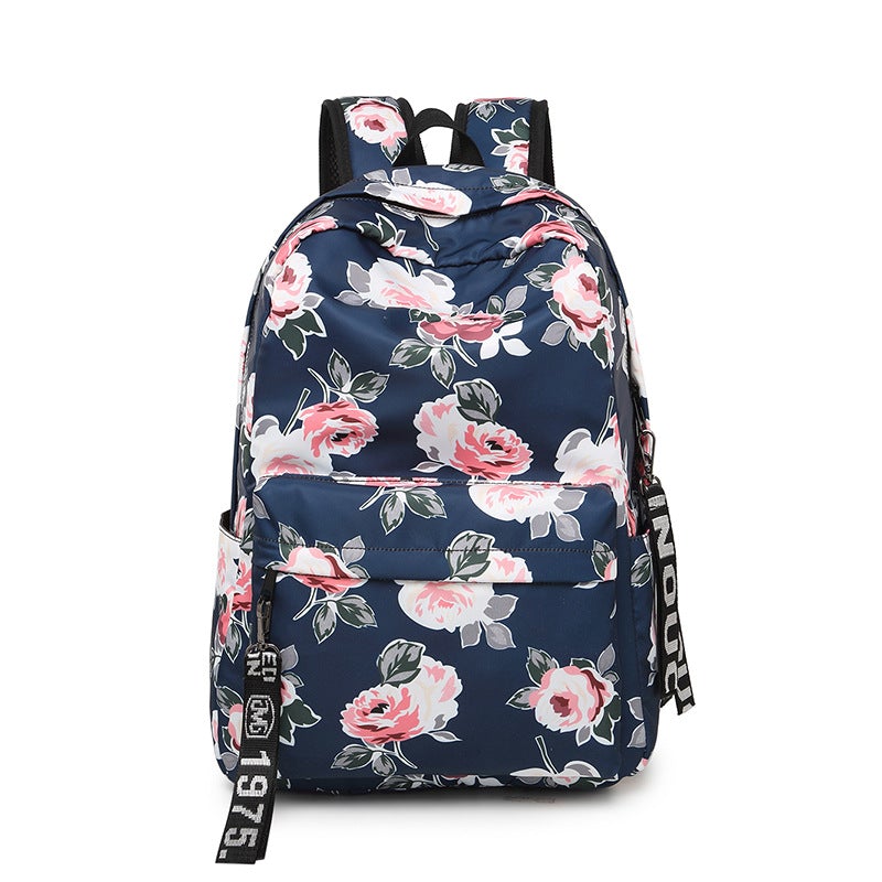 Printed Flowers Nylon Waterproof Ethnic Travel Backpack featuring a vibrant floral design, durable nylon material, and multiple storage compartments.