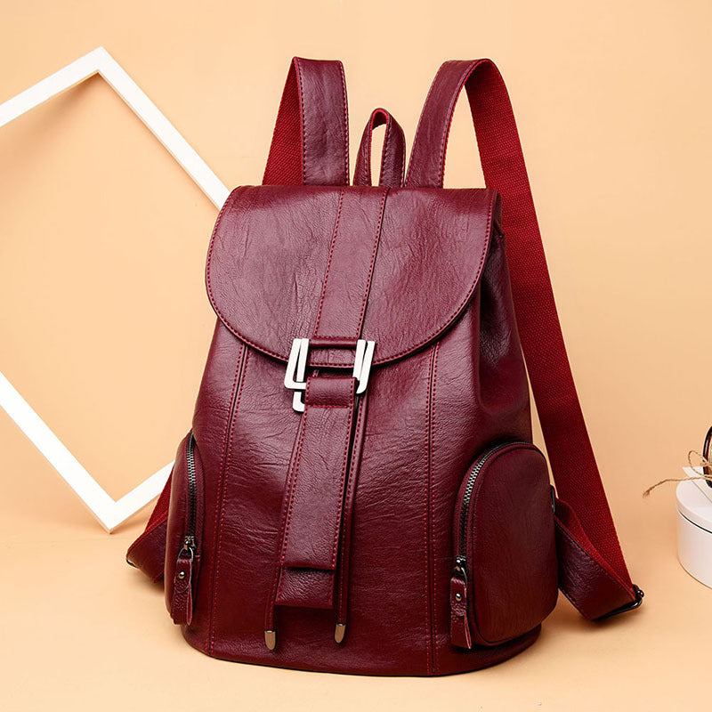 Stylish PU leather ladies backpack with draw buckle and belt decoration, featuring a soft texture and double straps.
