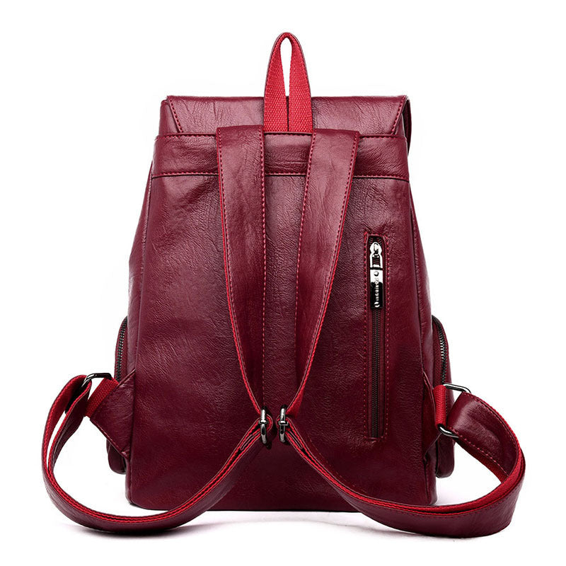 Stylish PU leather ladies backpack with draw buckle and belt decoration, featuring a soft texture and double straps.