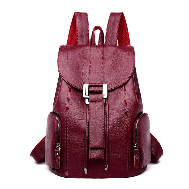 Stylish PU leather ladies backpack with draw buckle and belt decoration, featuring a soft texture and double straps.