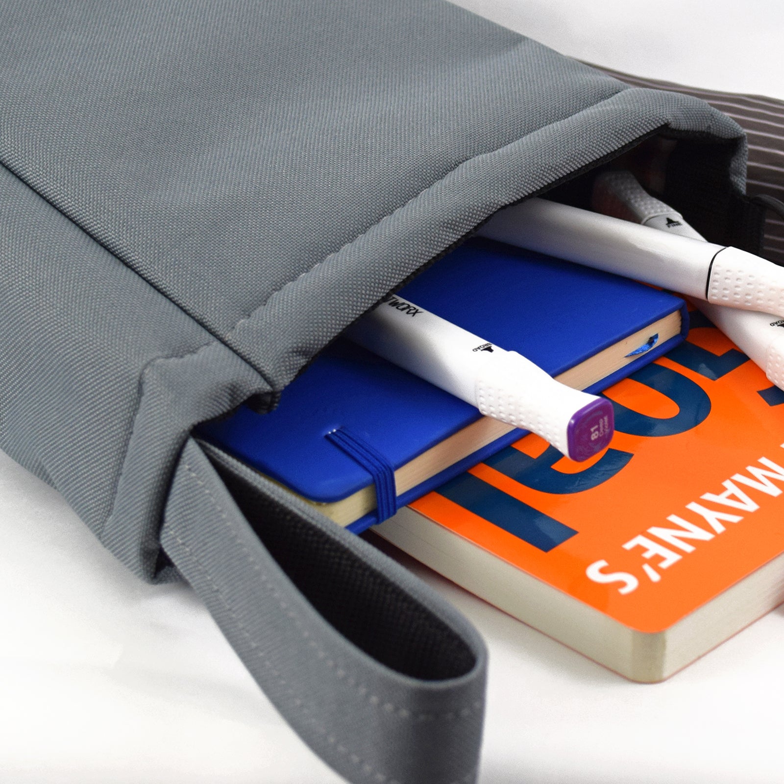 Grey UTILITY Pouch Grab Bag with cushioned interior and adjustable straps, ideal for organizing small items.