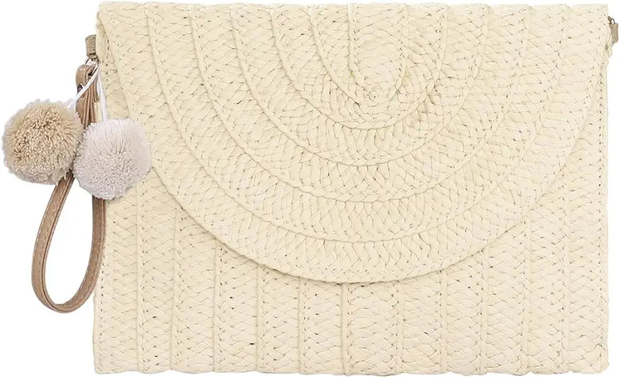 A stylish straw woven raffia envelope clutch bag with intricate weaving, perfect for bohemian fashion lovers.